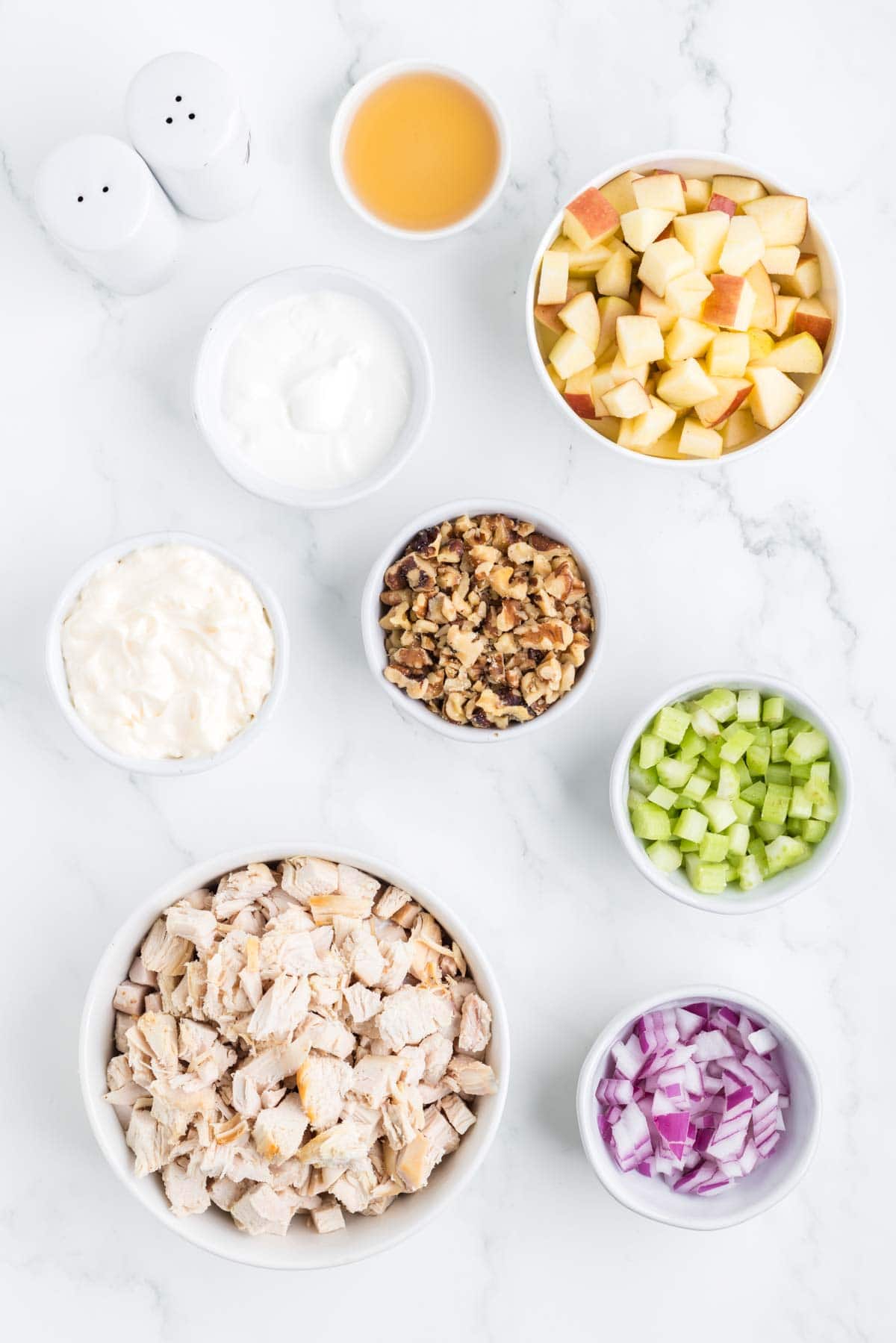 chicken salad ingredients in prep bowls