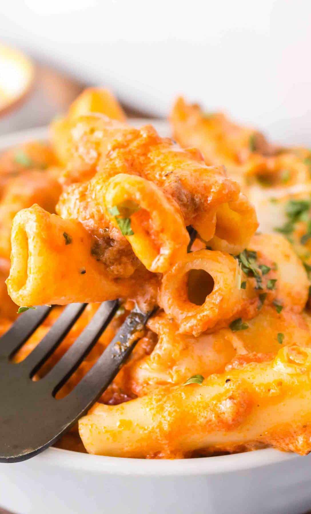 Baked Ziti with Ground Beef is a hearty baked pasta recipe loaded with ground beef, marinara sauce, sour cream, heavy cream, provolone and mozzarella cheese.