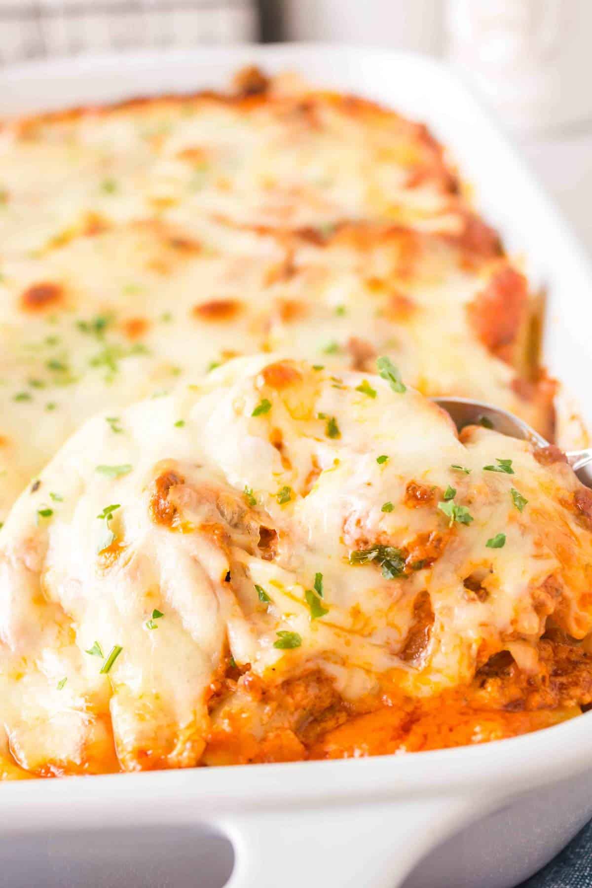 Baked Ziti with Ground Beef is a hearty baked pasta recipe loaded with ground beef, marinara sauce, sour cream, heavy cream, provolone and mozzarella cheese.