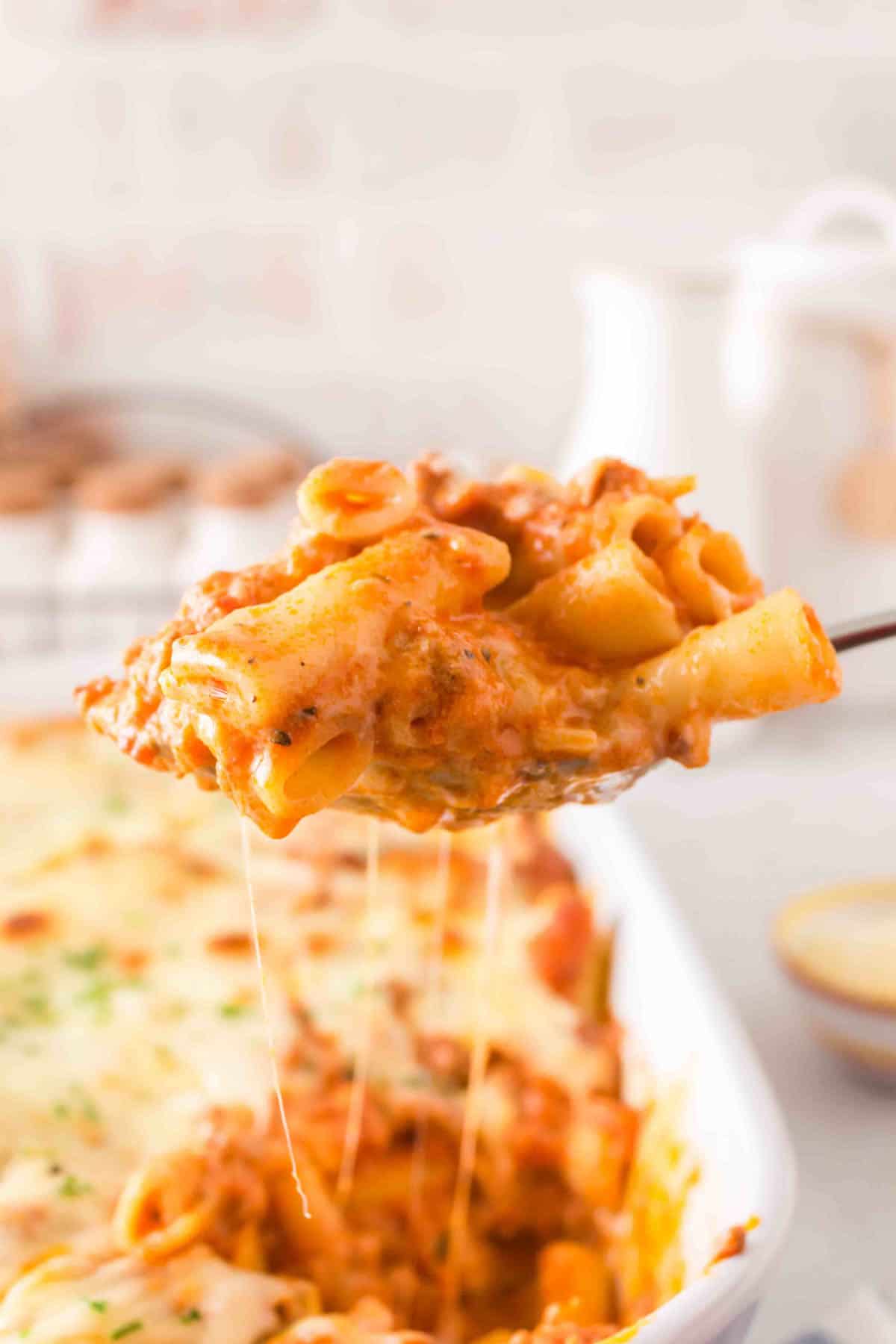 Baked Ziti with Ground Beef is a hearty baked pasta recipe loaded with ground beef, marinara sauce, sour cream, heavy cream, provolone and mozzarella cheese.