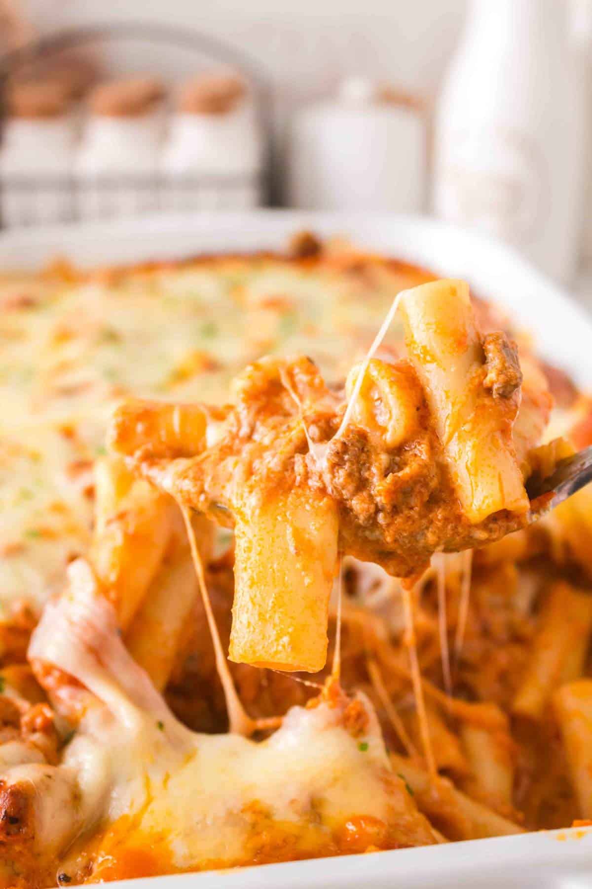 Baked Ziti with Ground Beef is a hearty baked pasta recipe loaded with ground beef, marinara sauce, sour cream, heavy cream, provolone and mozzarella cheese.