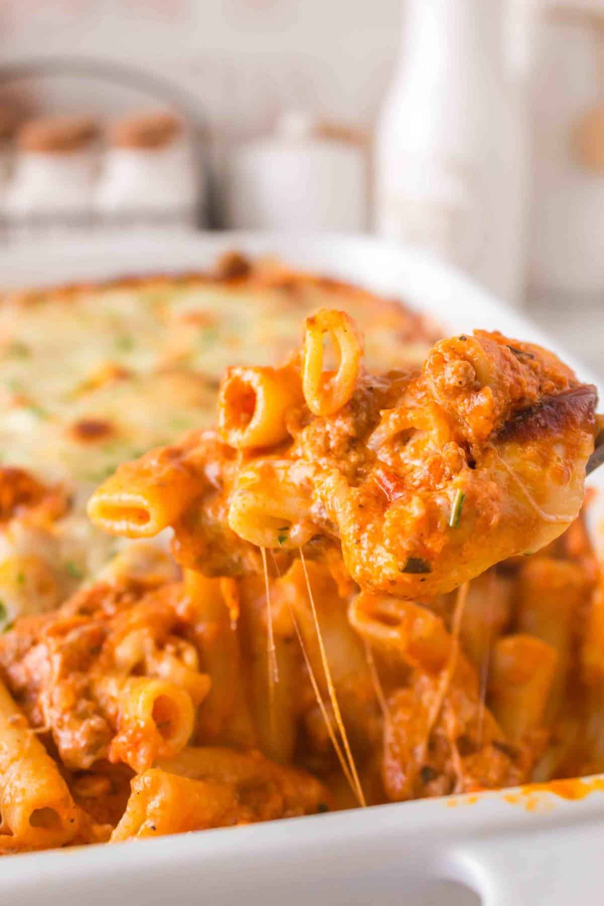 Baked Ziti with Ground Beef is a hearty baked pasta recipe loaded with ground beef, marinara sauce, sour cream, heavy cream, provolone and mozzarella cheese.