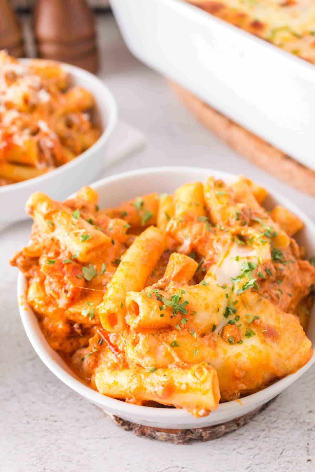 Baked Ziti with Ground Beef is a hearty baked pasta recipe loaded with ground beef, marinara sauce, sour cream, heavy cream, provolone and mozzarella cheese.