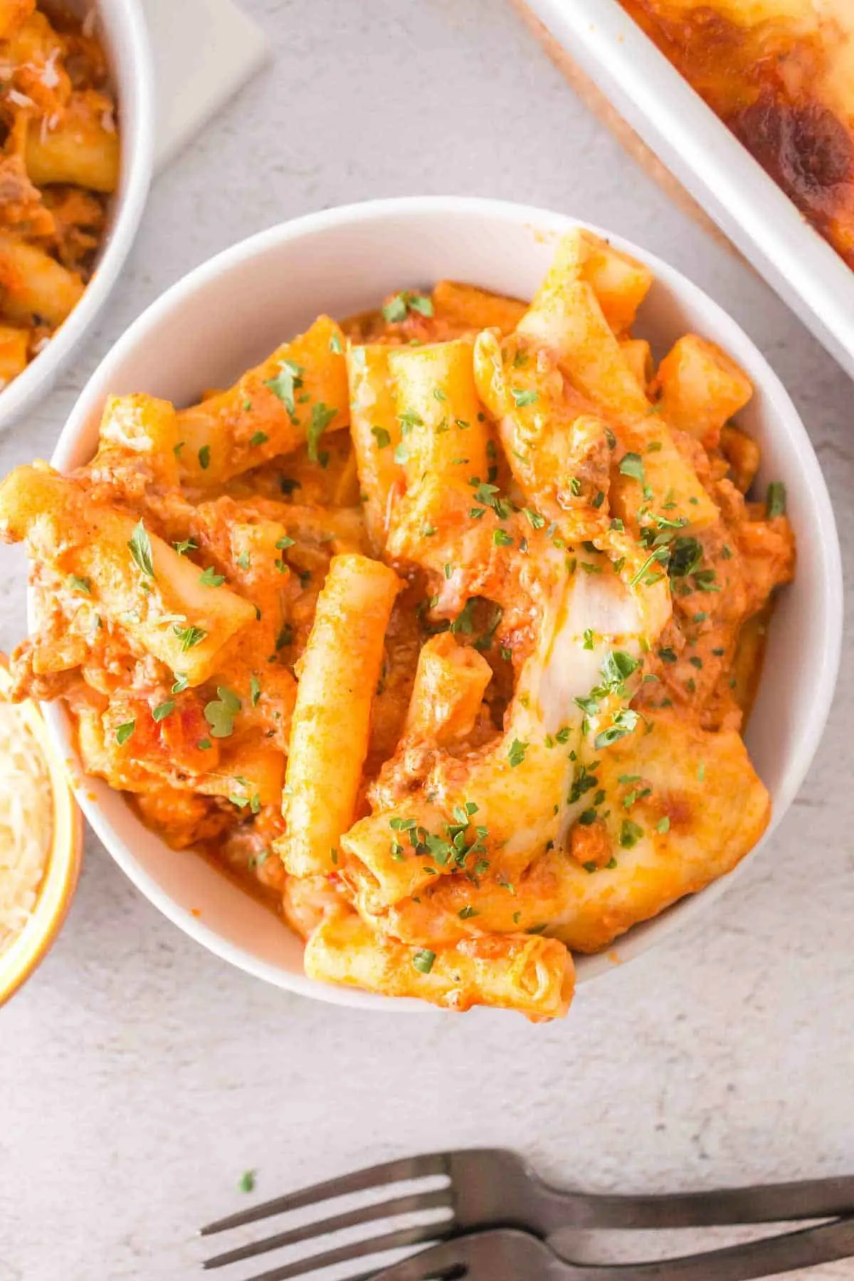 Baked Ziti with Ground Beef is a hearty baked pasta recipe loaded with ground beef, marinara sauce, sour cream, heavy cream, provolone and mozzarella cheese.