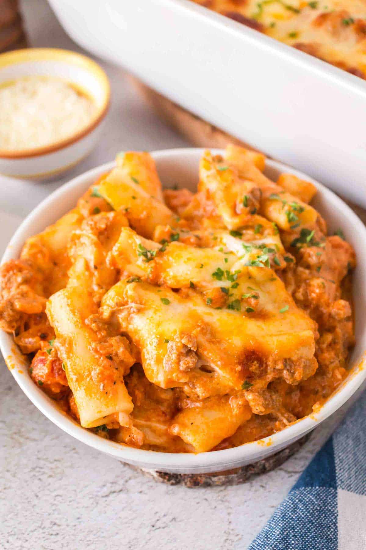 Baked Ziti with Ground Beef is a hearty baked pasta recipe loaded with ground beef, marinara sauce, sour cream, heavy cream, provolone and mozzarella cheese.