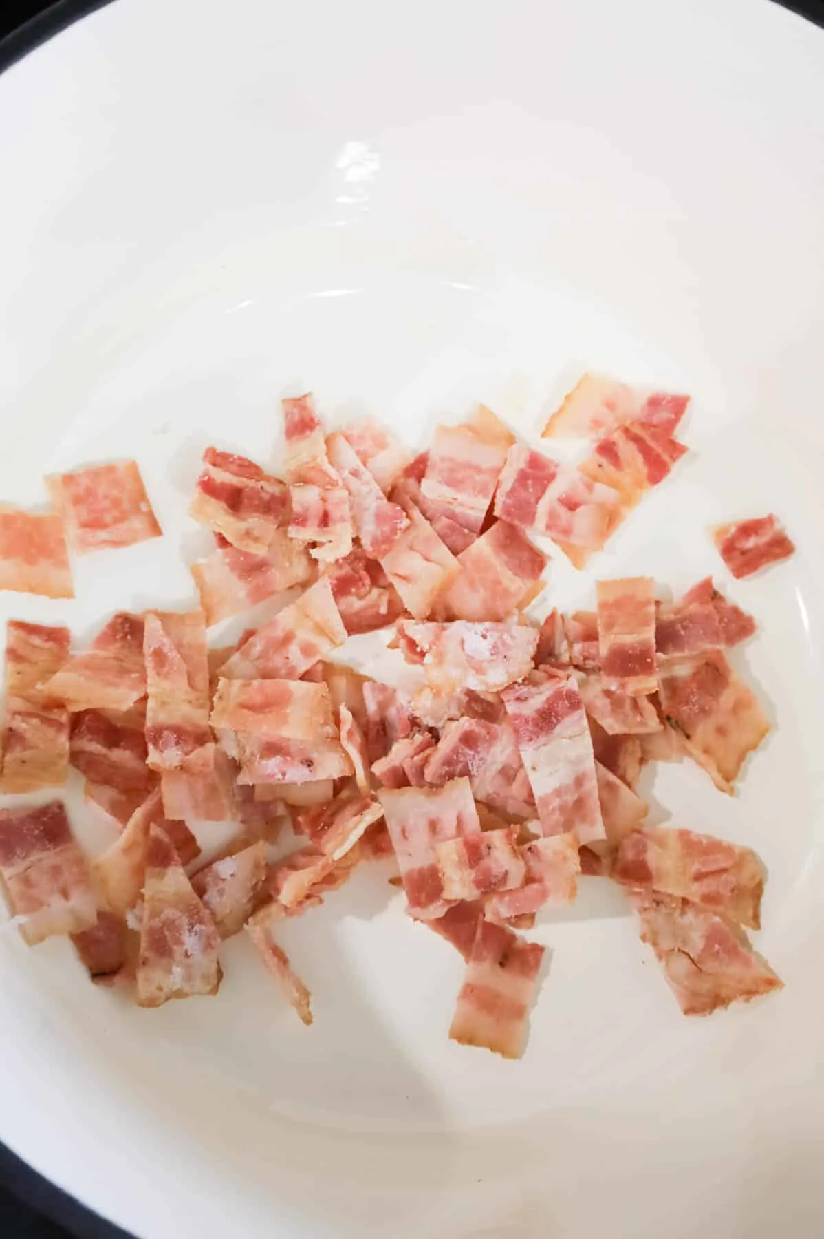 chopped bacon pieces in a Dutch oven