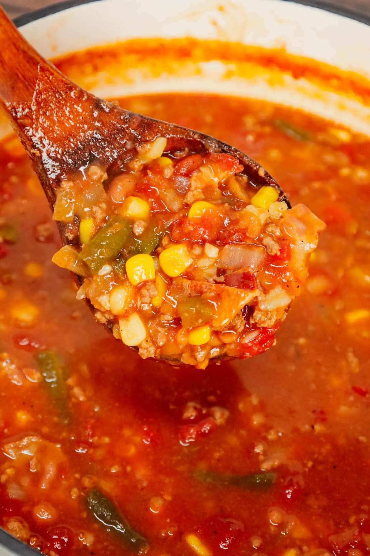 Cowboy Soup is hearty dish loaded with ground beef, bacon, Rotel, Bush's Original baked beans, green beans, corn and diced potatoes all in a flavourful broth.