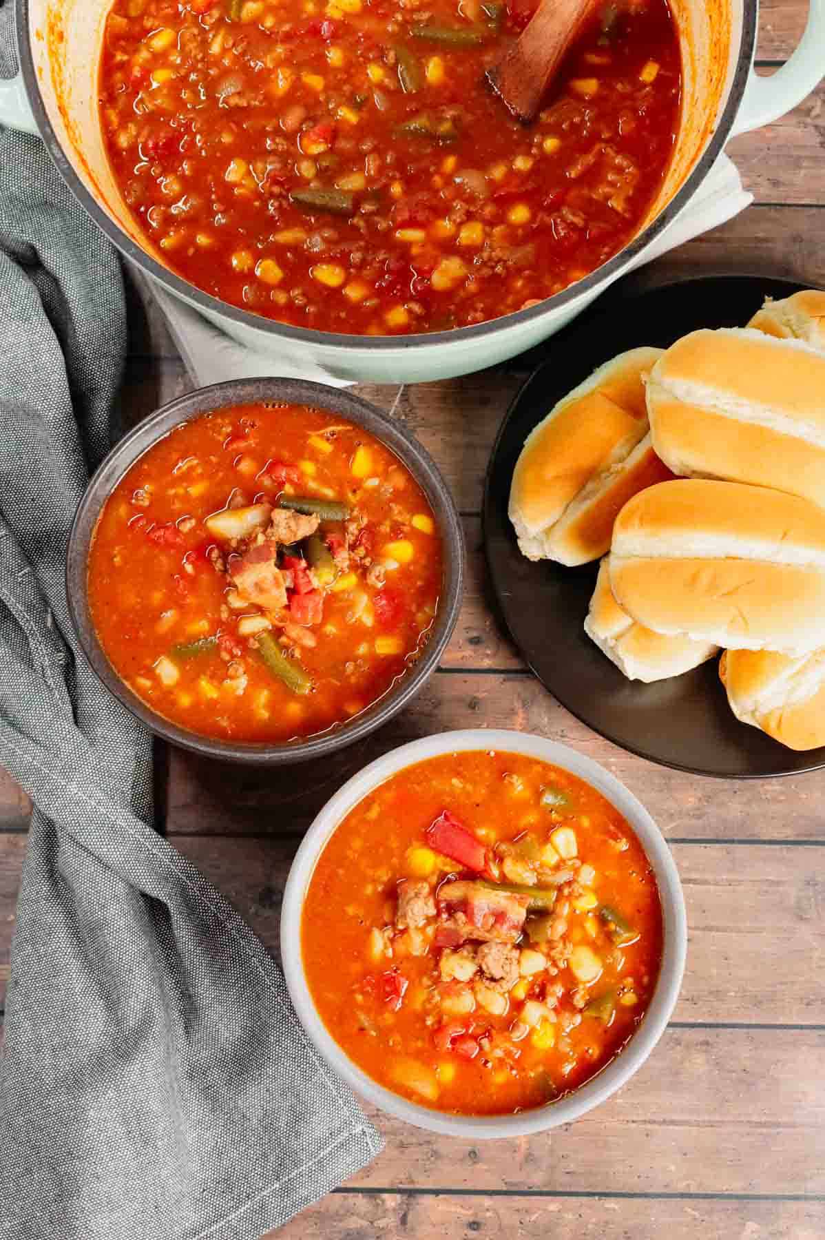 Cowboy Soup is hearty dish loaded with ground beef, bacon, Rotel, Bush's Original baked beans, green beans, corn and diced potatoes all in a flavourful broth.