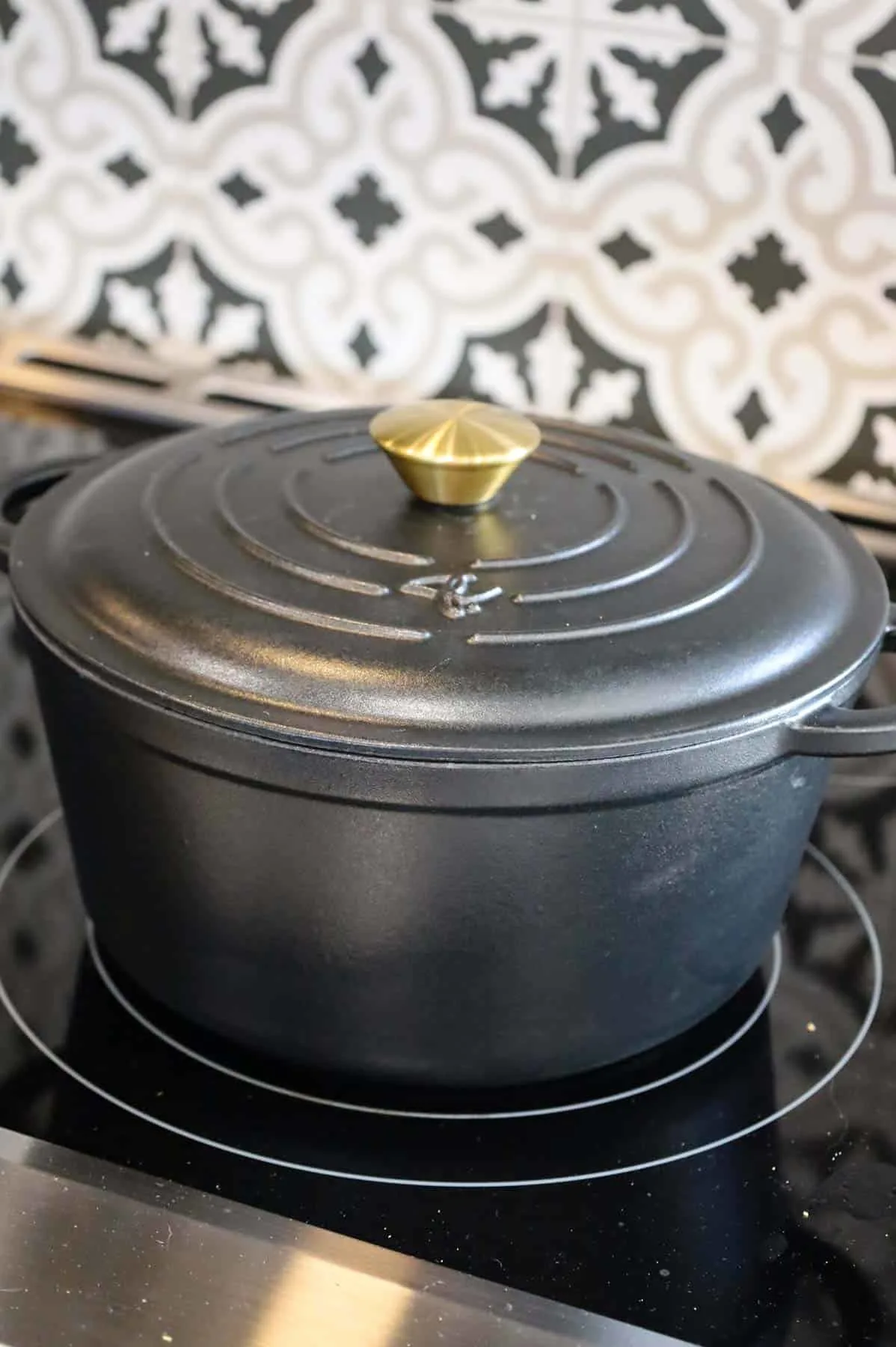Dutch oven with lid on, on a stove