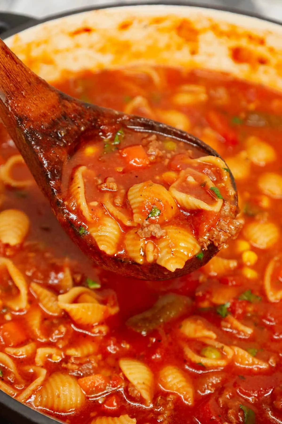 Italian Hamburger Soup is a hearty ground beef soup recipe loaded with mixed frozen veggies, diced tomatoes, Italian seasoning and small pasta shells all in a delicious tomato beef broth.