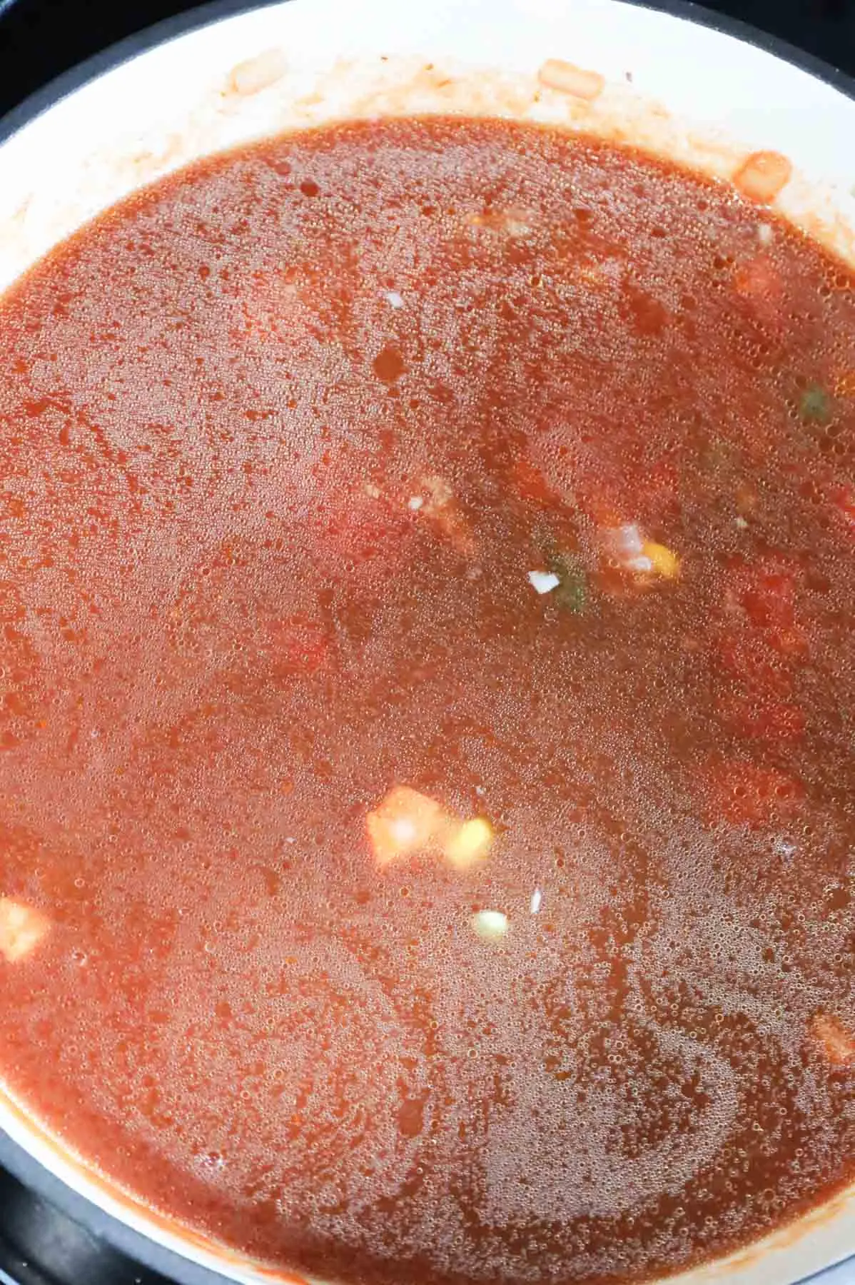 beef broth added to pot with tomato sauce, veggies and ground beef
