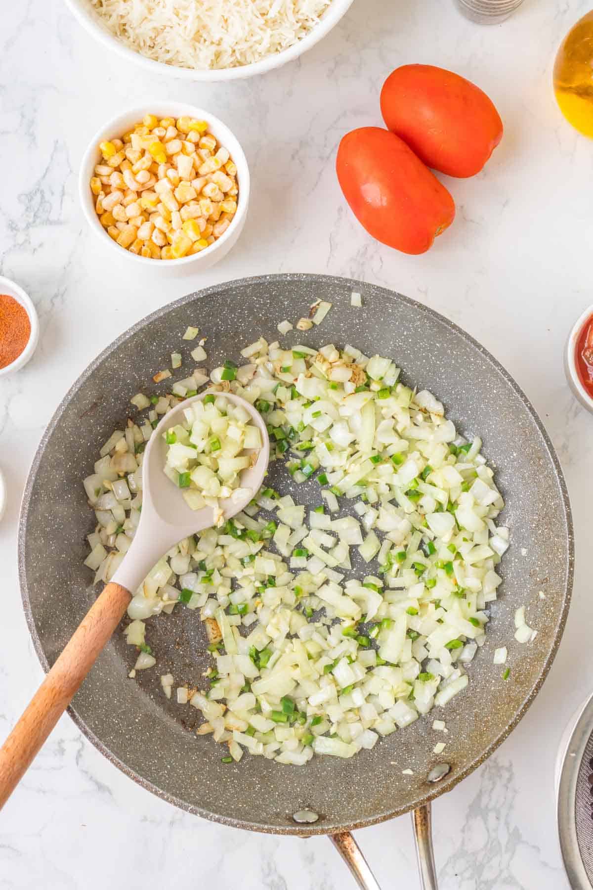 diced onions cooking in a skillet