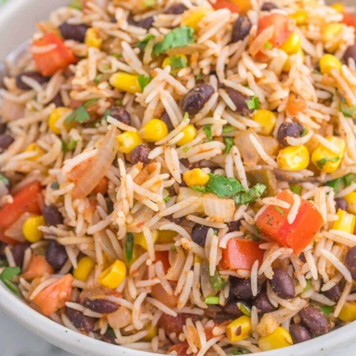 Mexican Fried Rice is a flavourful side dish loaded with onions, tomatoes, corn, black beans and salsa.