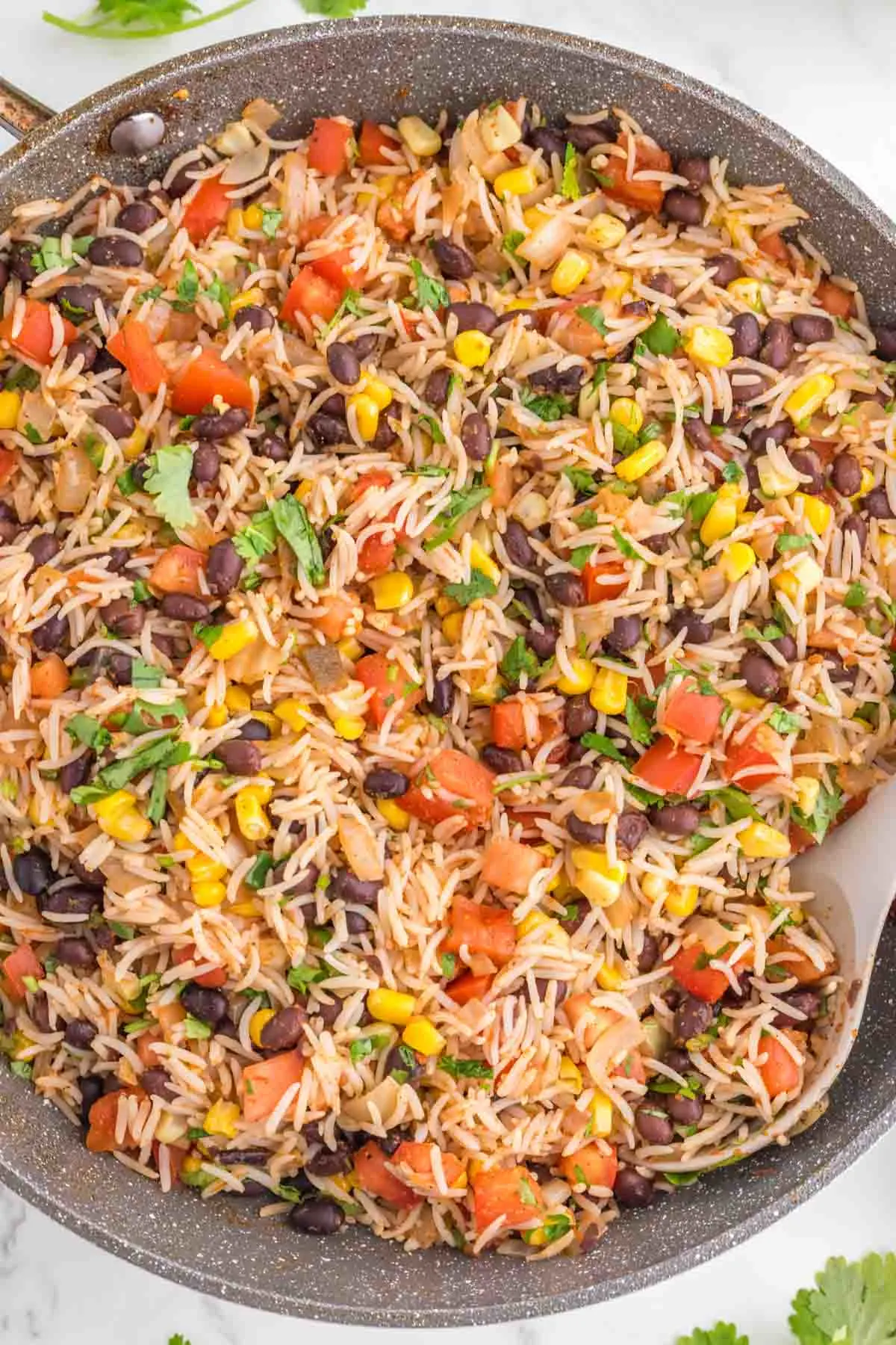 Mexican Fried Rice is a flavourful side dish loaded with onions, tomatoes, corn, black beans and salsa.