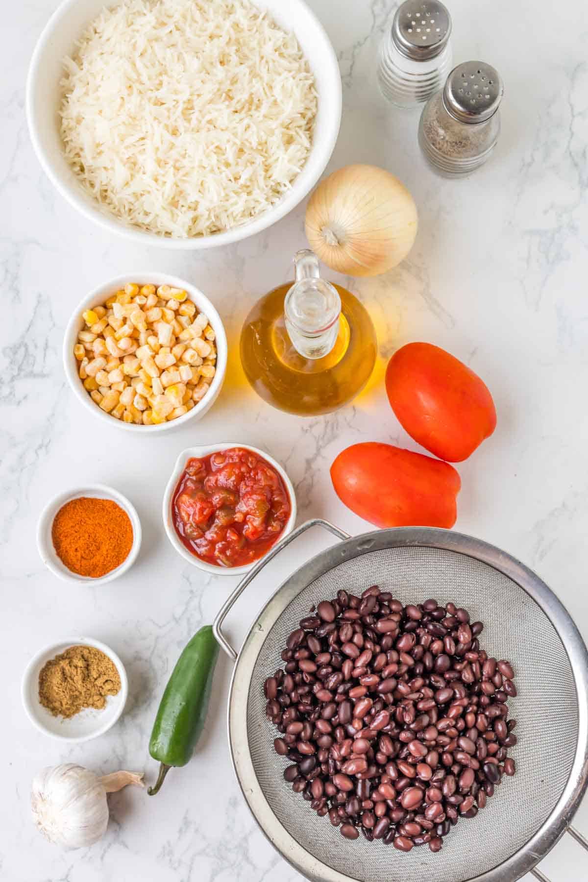 Mexican fried rice ingredients in prep bowls