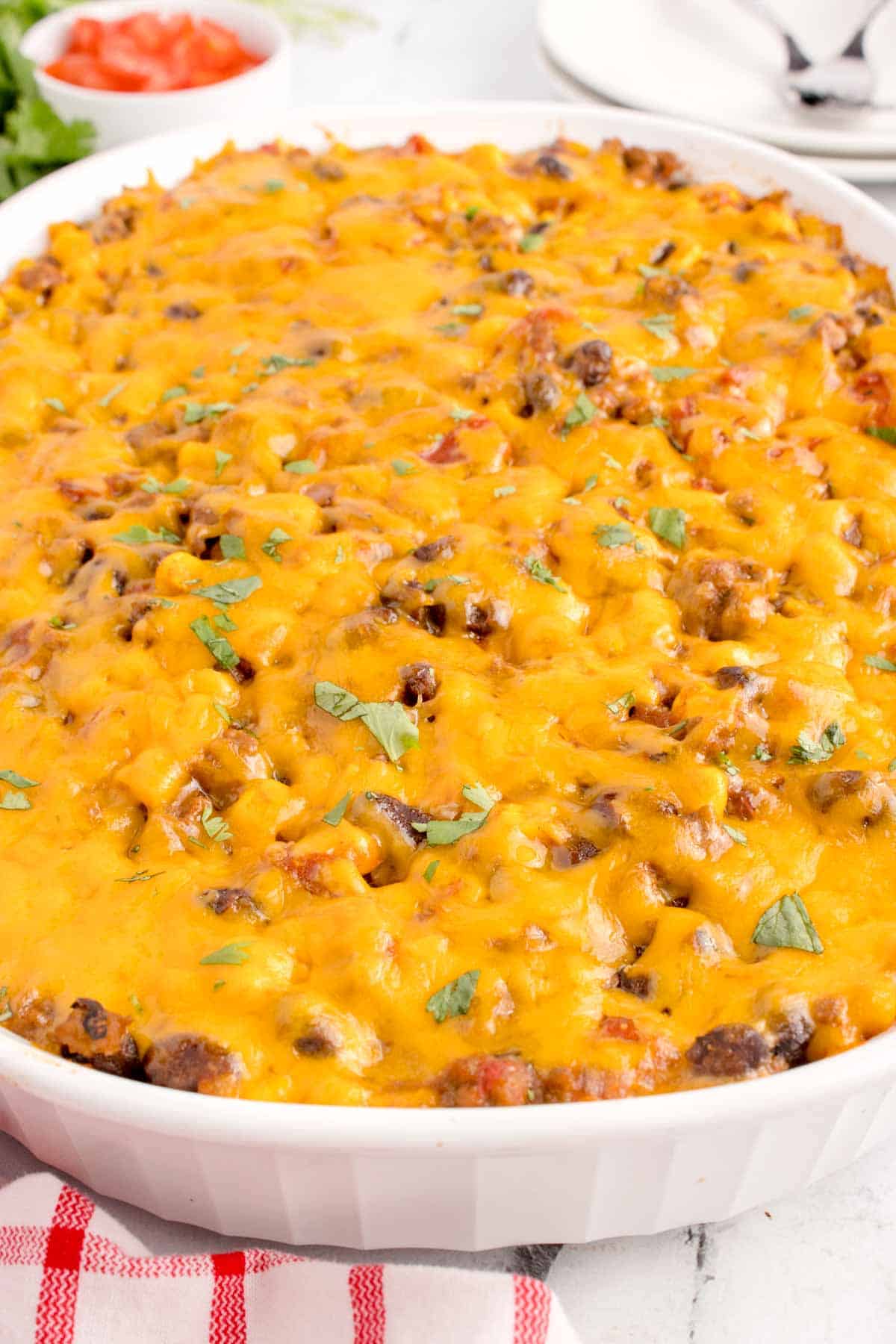 Mexican Ground Beef Casserole is a hearty dish loaded with ground beef, diced tomatoes, black beans, corn, cheddar cheese and corn tortillas.