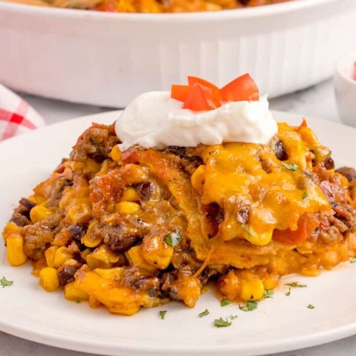 Mexican Ground Beef Casserole is a hearty dish loaded with ground beef, diced tomatoes, black beans, corn, cheddar cheese and corn tortillas.