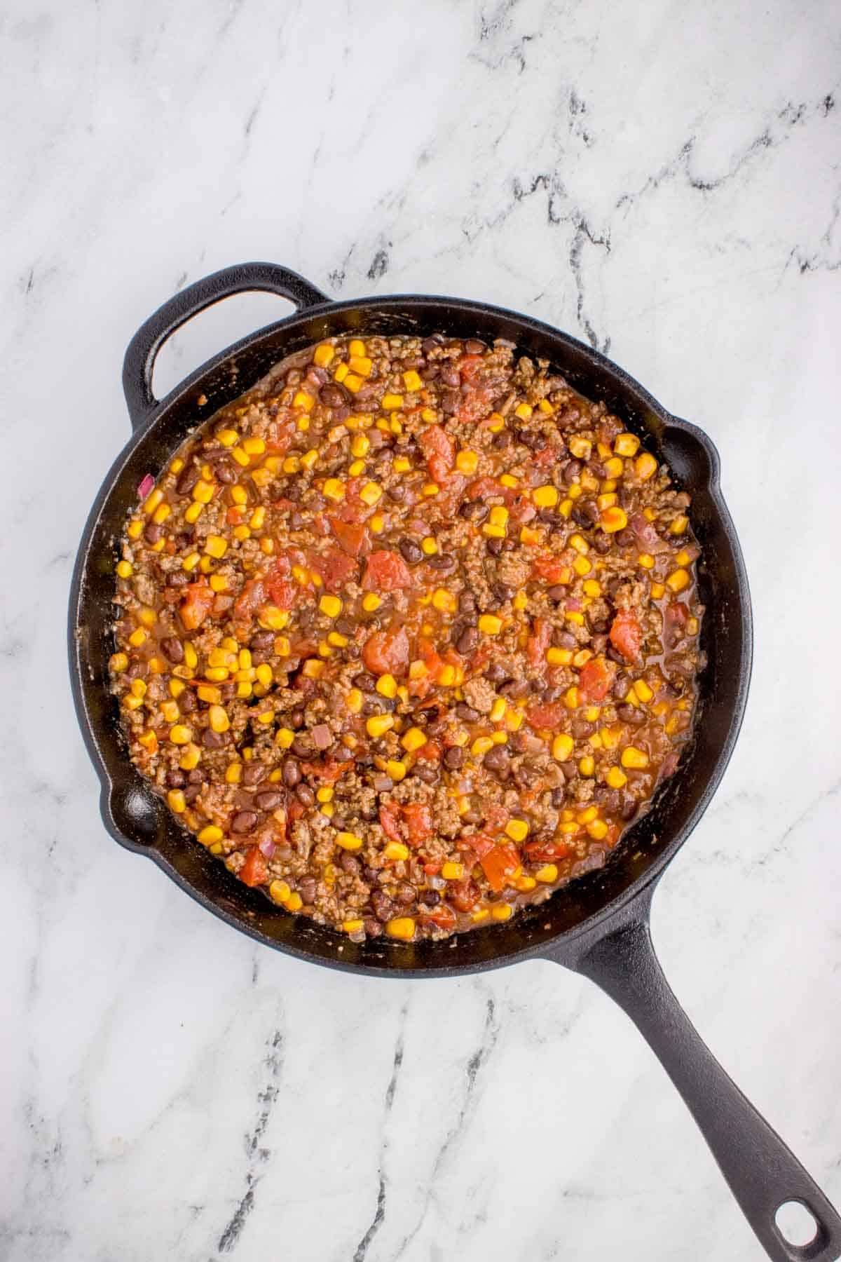 ground beef, tomato, corn and bean mixture in a skillet