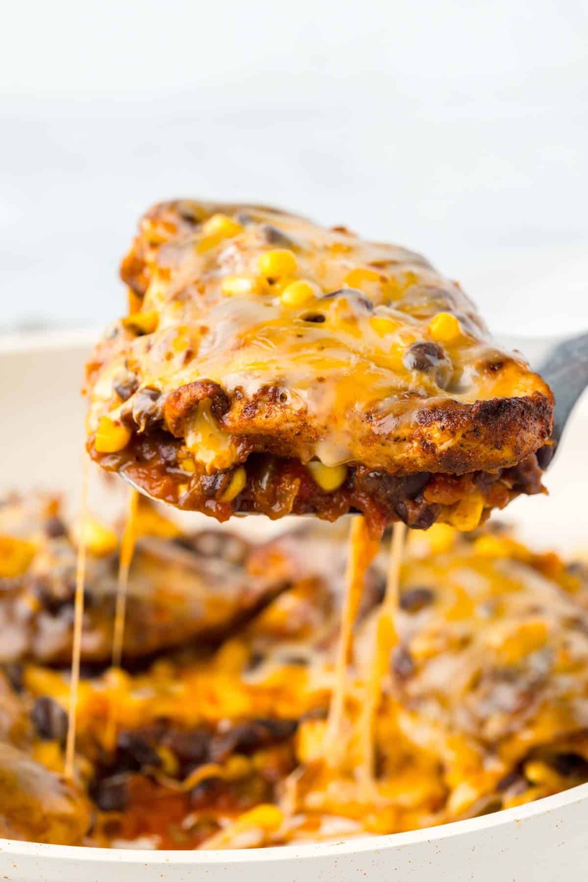 Santa Fe Chicken is a delicious skillet chicken breast dish loaded with spices, salsa, black beans, corn and Colby Jack cheese.