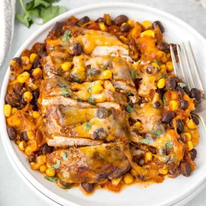 Santa Fe Chicken is a delicious skillet chicken breast dish loaded with spices, salsa, black beans, corn and Colby Jack cheese.