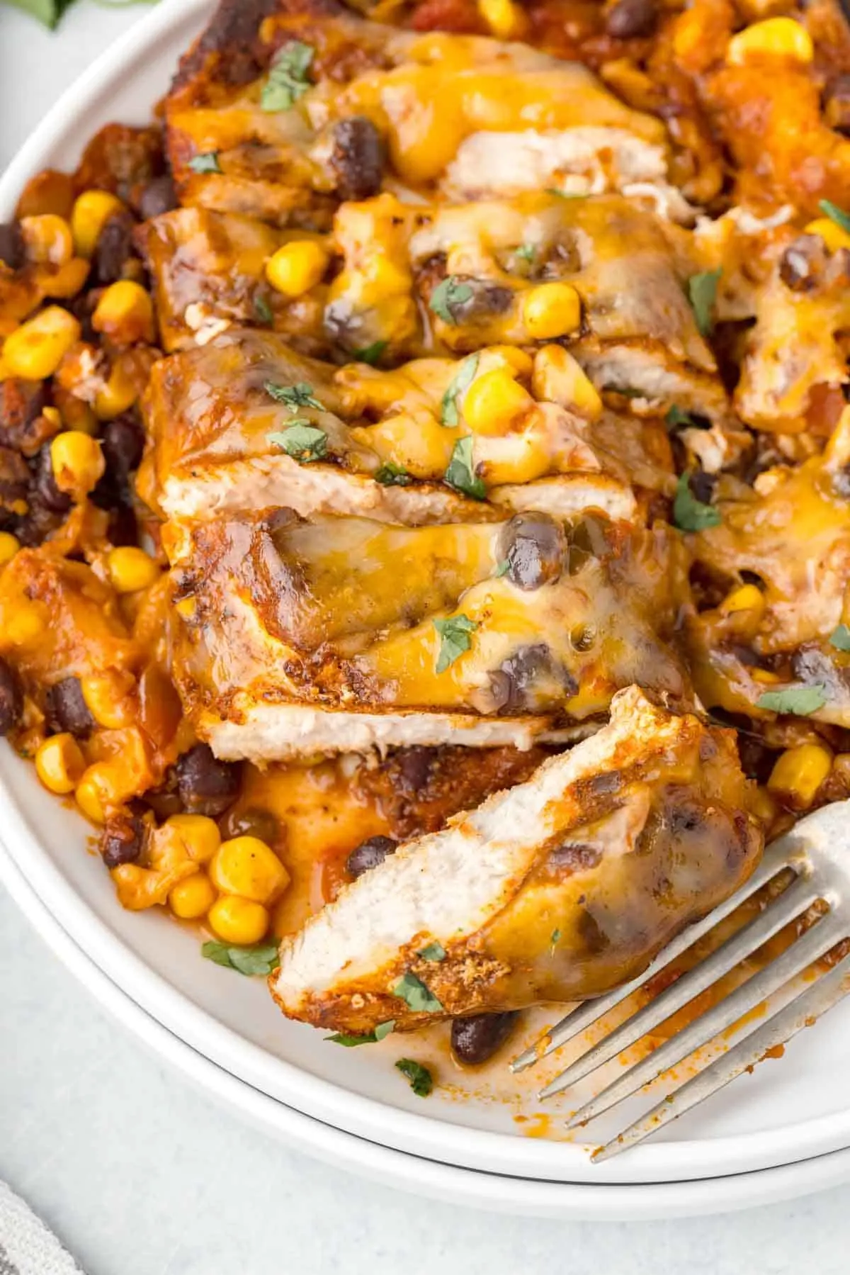 Santa Fe Chicken is a delicious skillet chicken breast dish loaded with spices, salsa, black beans, corn and Colby Jack cheese.
