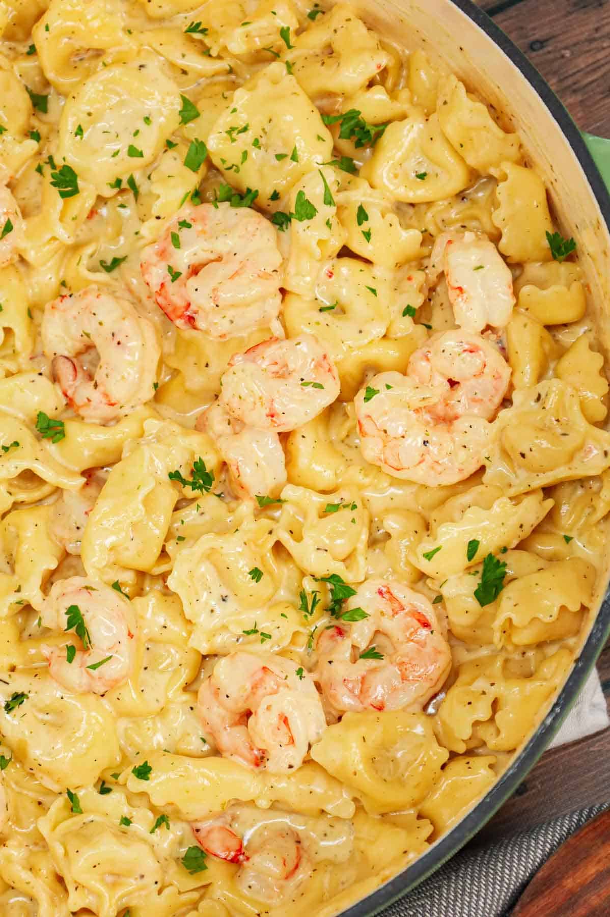 Shrimp Tortellini Alfredo is a delicious seafood pasta recipe with cheese tortellini and tender shrimp all tossed in a creamy garlic parmesan sauce.