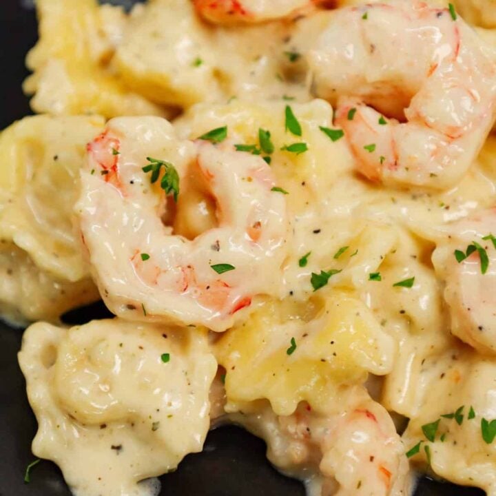 Shrimp Tortellini Alfredo is a delicious seafood pasta recipe with cheese tortellini and tender shrimp all tossed in a creamy garlic parmesan sauce.