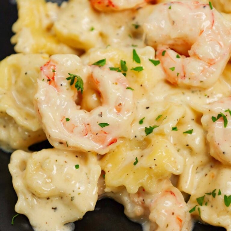 Shrimp Tortellini Alfredo is a delicious seafood pasta recipe with cheese tortellini and tender shrimp all tossed in a creamy garlic parmesan sauce.
