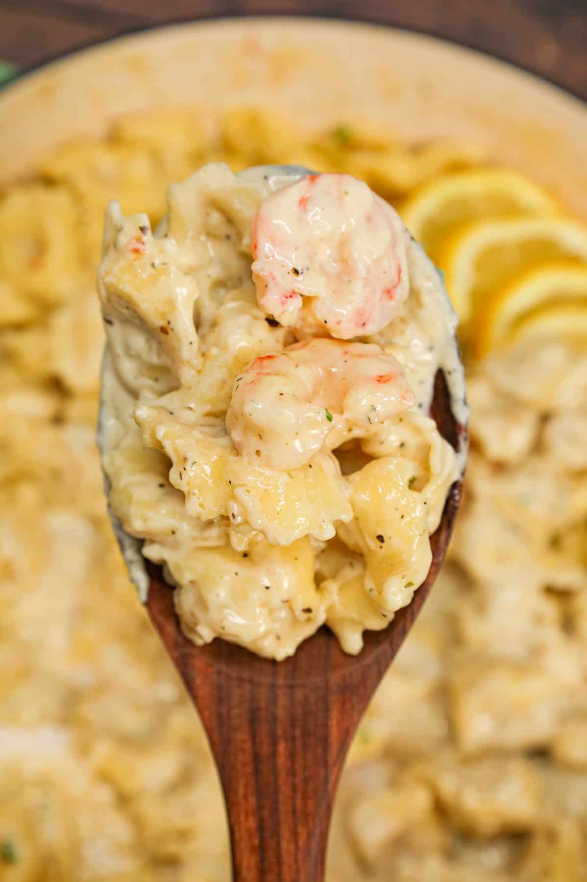 Shrimp Tortellini Alfredo is a delicious seafood pasta recipe with cheese tortellini and tender shrimp all tossed in a creamy garlic parmesan sauce.