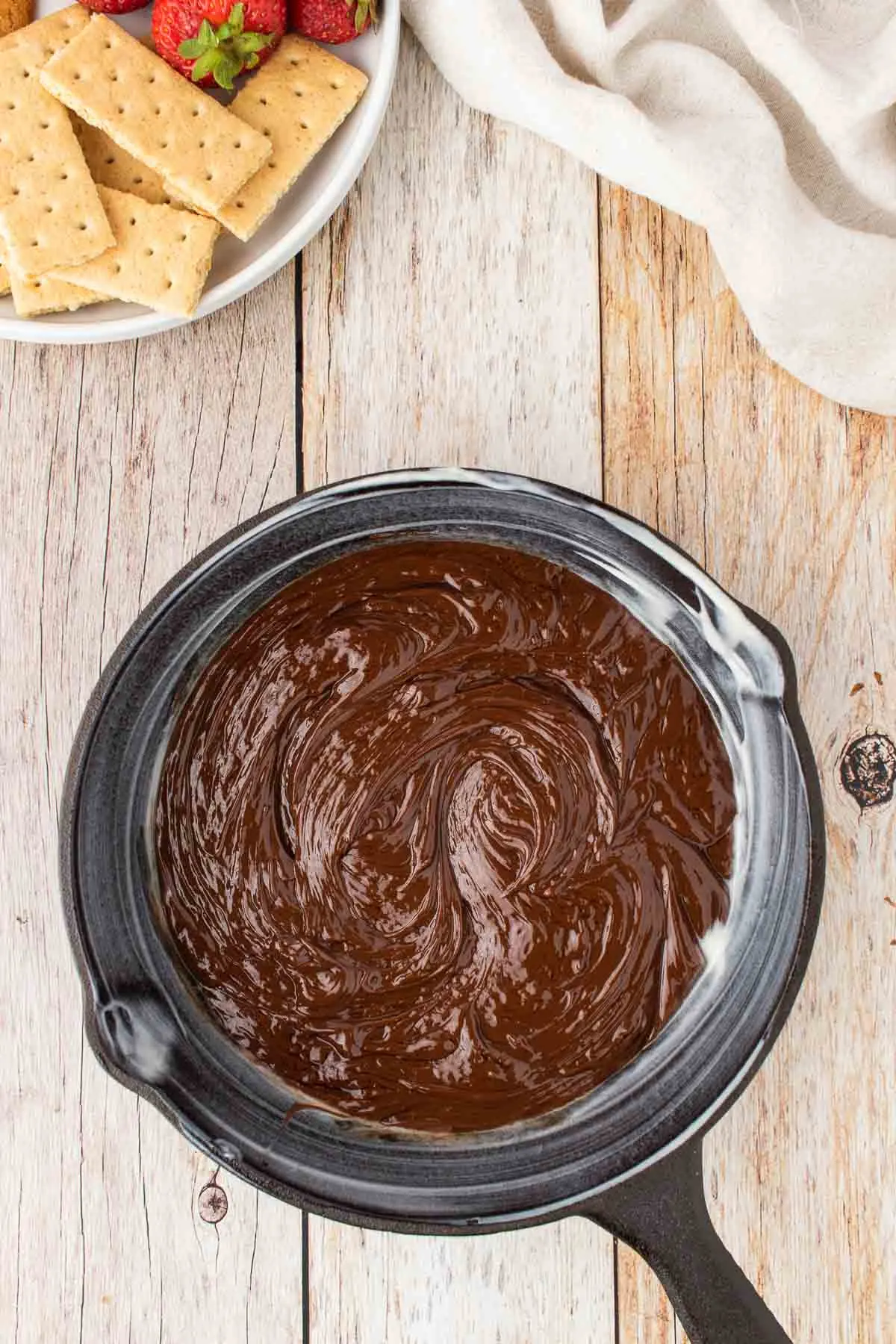 melted chocolate mixture in a cast iron skillet