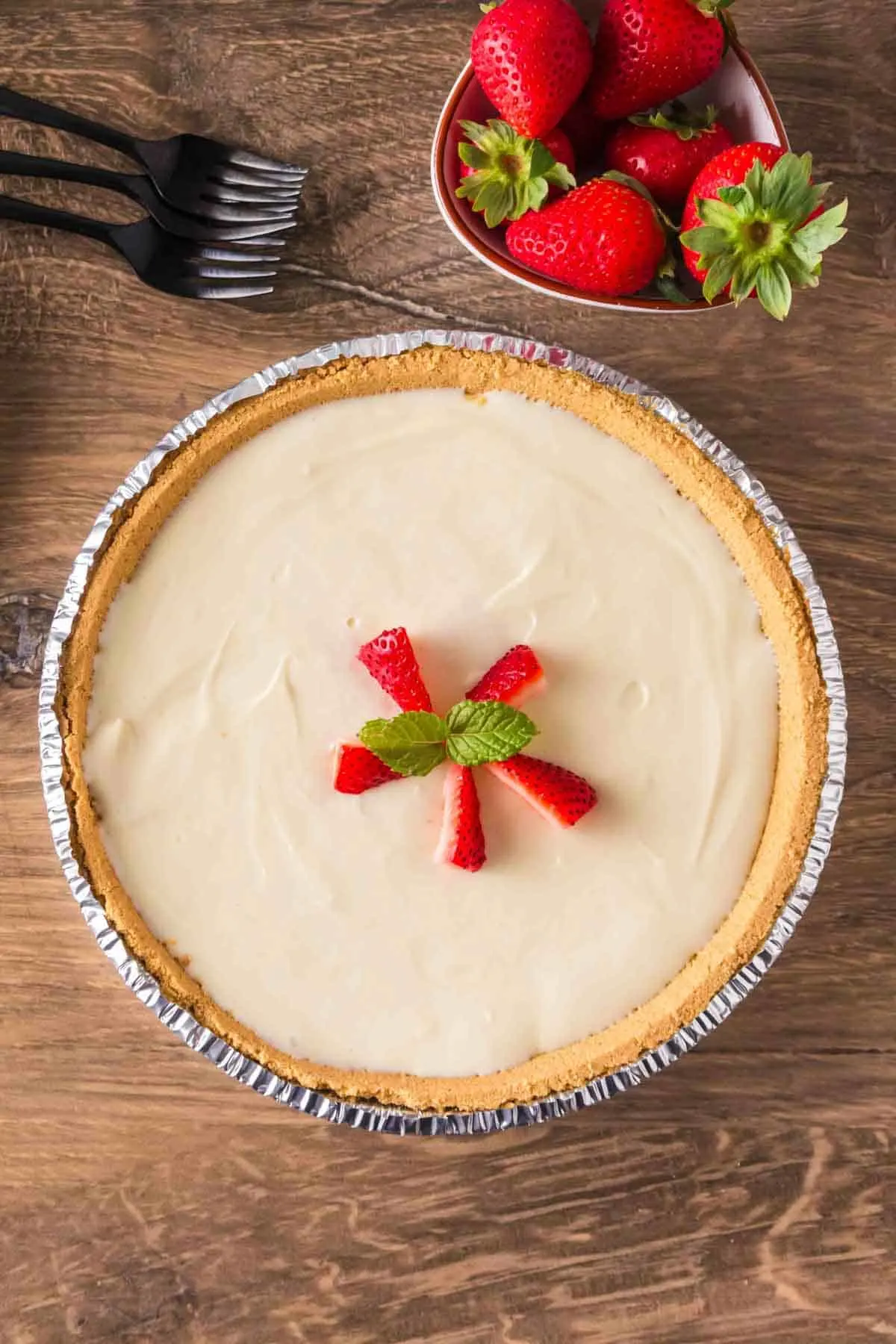 3 Ingredient Cheesecake is an easy no bake dessert recipe made with a graham pie crust, cream cheese and sweetened condensed milk.