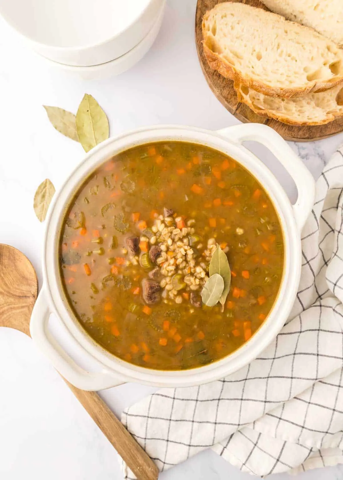 Beef Barley Soup is a hearty soup recipe loaded with chunks of beef, barley, carrots, onion and celery all in a flavourful beef broth with red wine.