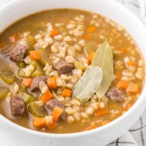 Beef Barley Soup is a hearty soup recipe loaded with chunks of beef, barley, carrots, onion and celery all in a flavourful beef broth with red wine.