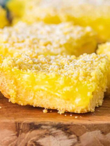 Cake Mix Lemon Bars are a sweet and tangy three ingredient dessert recipe made with boxed lemon cake mix, butter and lemon pie filling.