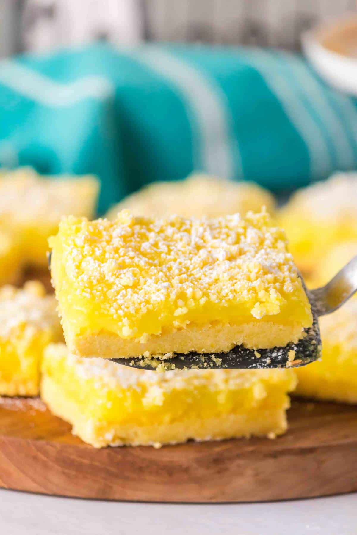 Cake Mix Lemon Bars are a sweet and tangy three ingredient dessert recipe made with boxed lemon cake mix, butter and lemon pie filling.