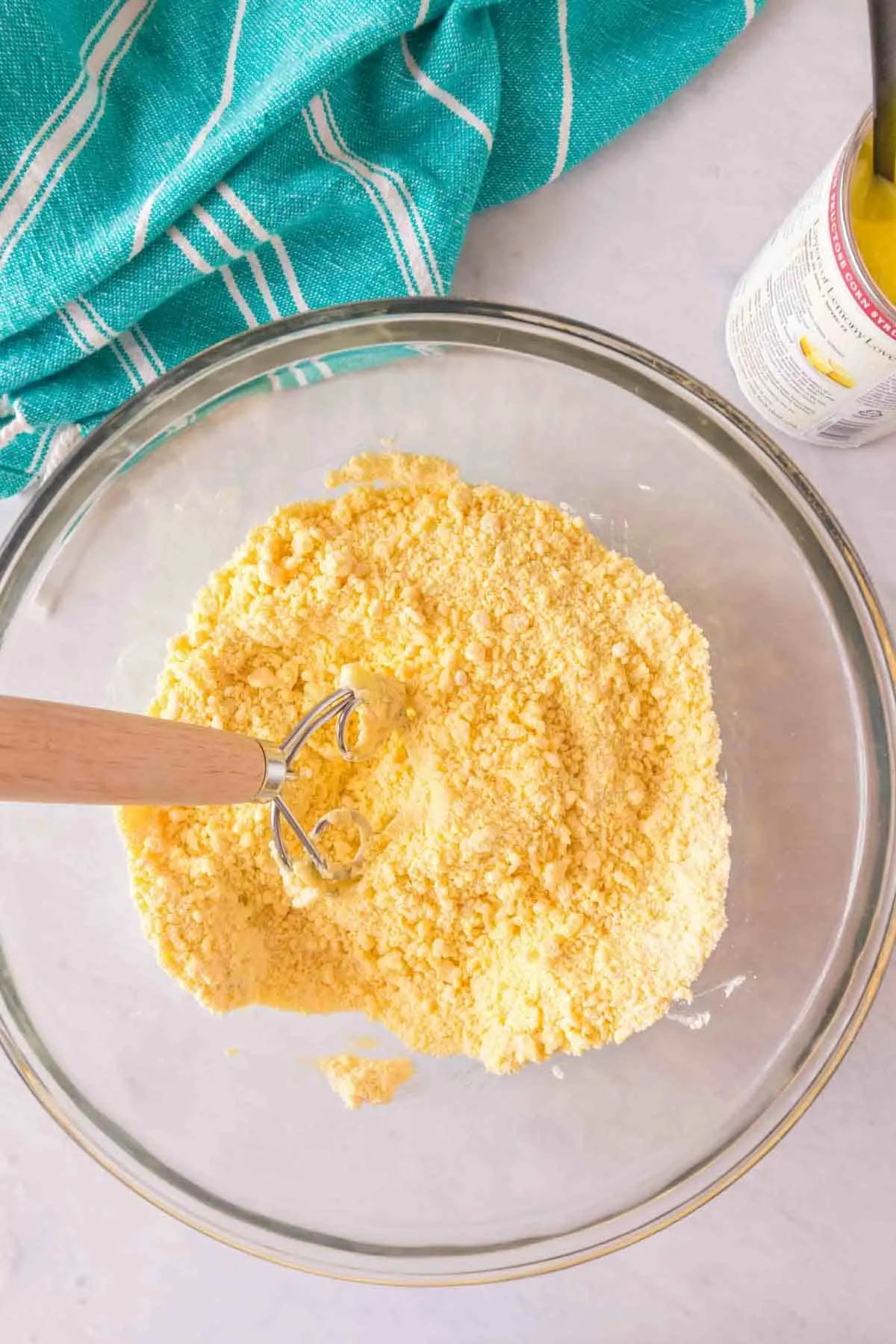 combining lemon cake mix and softened butter in a bowl