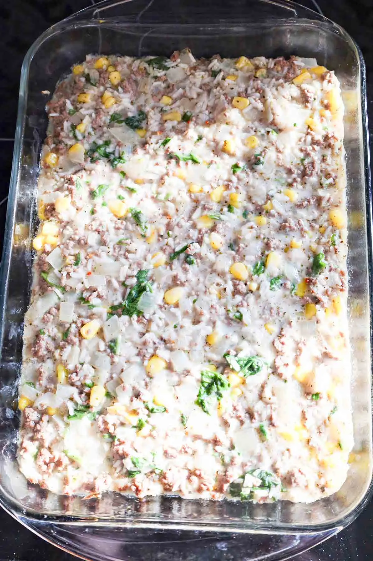 ground beef, rice and veggie mixture in a baking dish