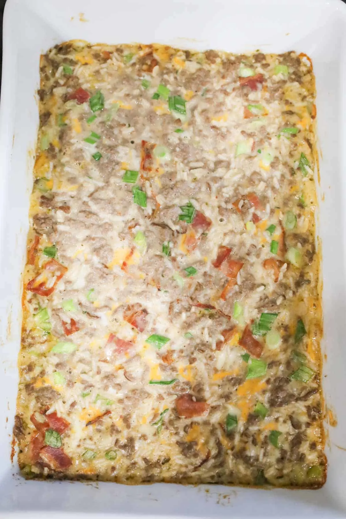 cheesy ground beef and rice mixture in a casserole dish after baking