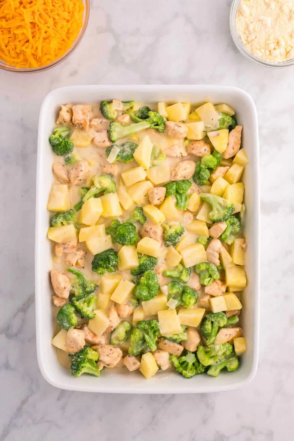creamy chicken, broccoli and potato mixture in a baking dish