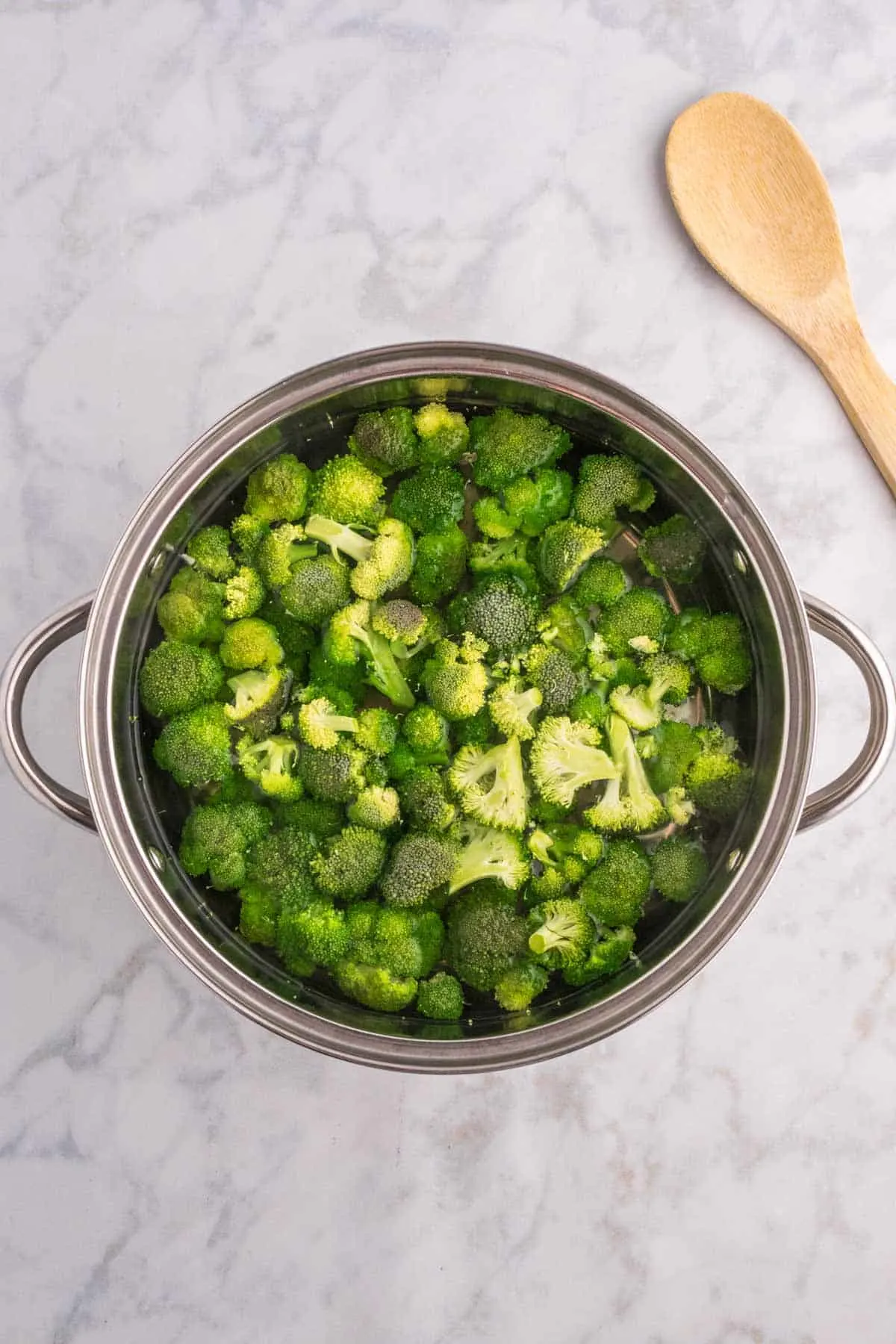 broccoli florets in a pot of water