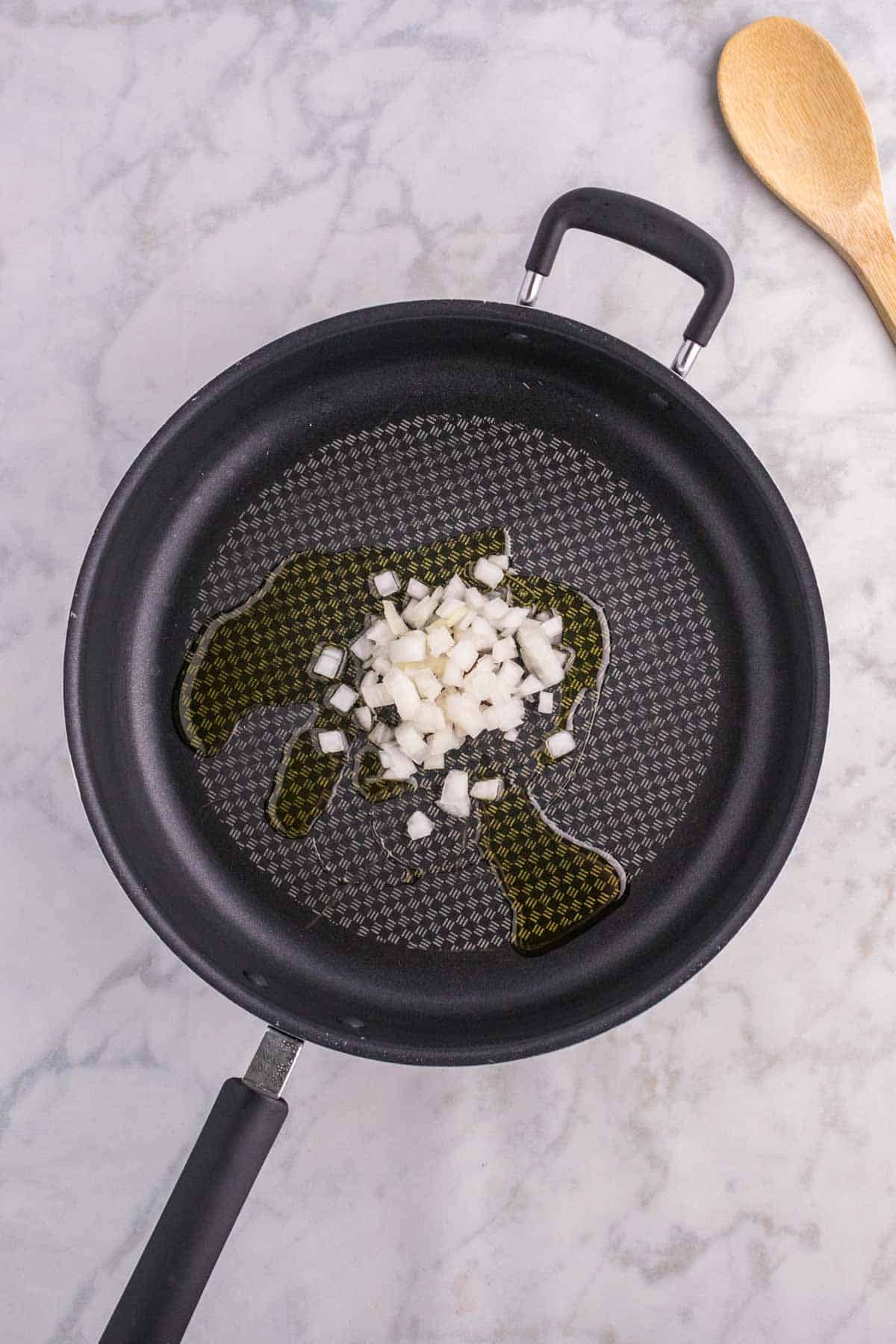 olive oil and chopped onions in a skillet
