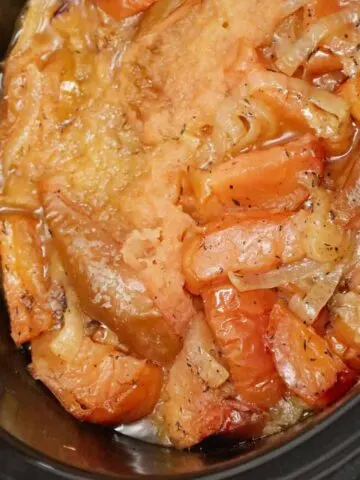 Crock Pot Apple Pork Chops are an easy slow cooker dinner recipe made with boneless pork chops, green apples, red apples and sliced onions.