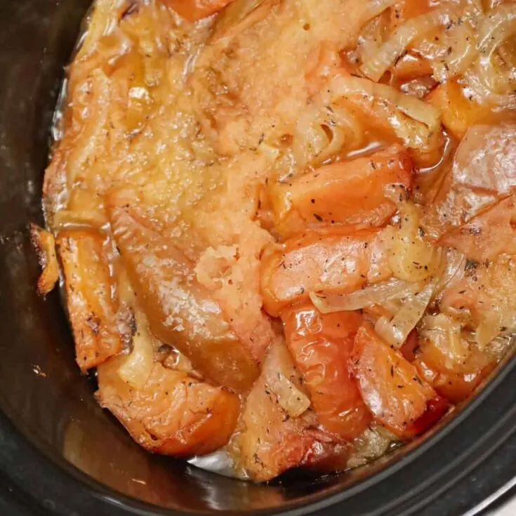 Crock Pot Apple Pork Chops are an easy slow cooker dinner recipe made with boneless pork chops, green apples, red apples and sliced onions.