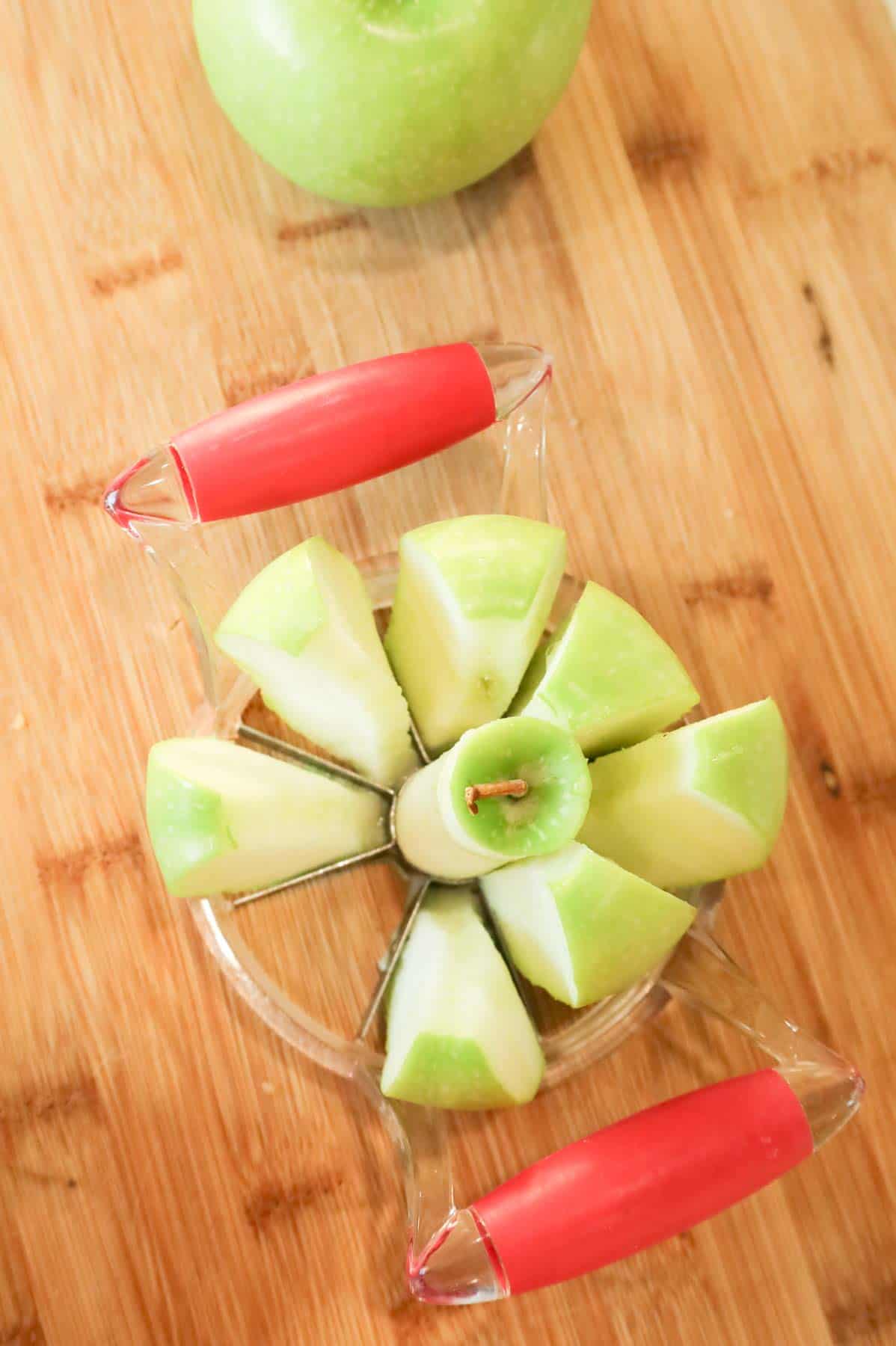 sliced green apple on a cutting board
