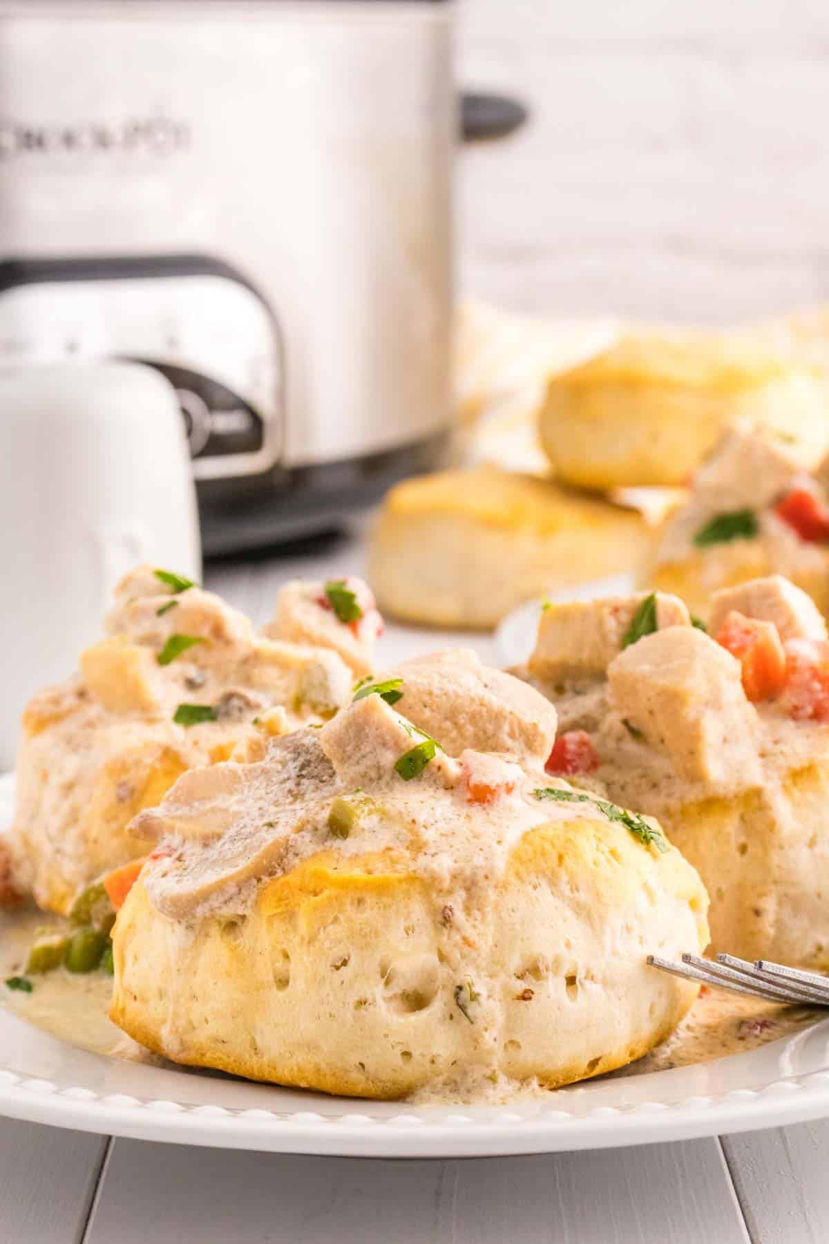 Crock Pot Chicken a la King is an easy slow cooker chicken dinner recipe loaded with chunks of chicken, bell peppers, mushrooms, peas, carrots and pimentos all in a creamy sauce that can be served over biscuits, rice or noodles.