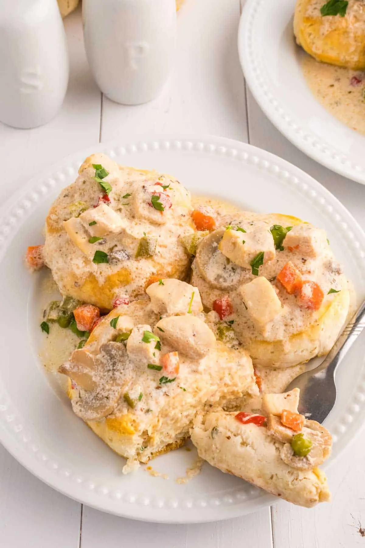 Crock Pot Chicken a la King is an easy slow cooker chicken dinner recipe loaded with chunks of chicken, bell peppers, mushrooms, peas, carrots and pimentos all in a creamy sauce that can be served over biscuits, rice or noodles.