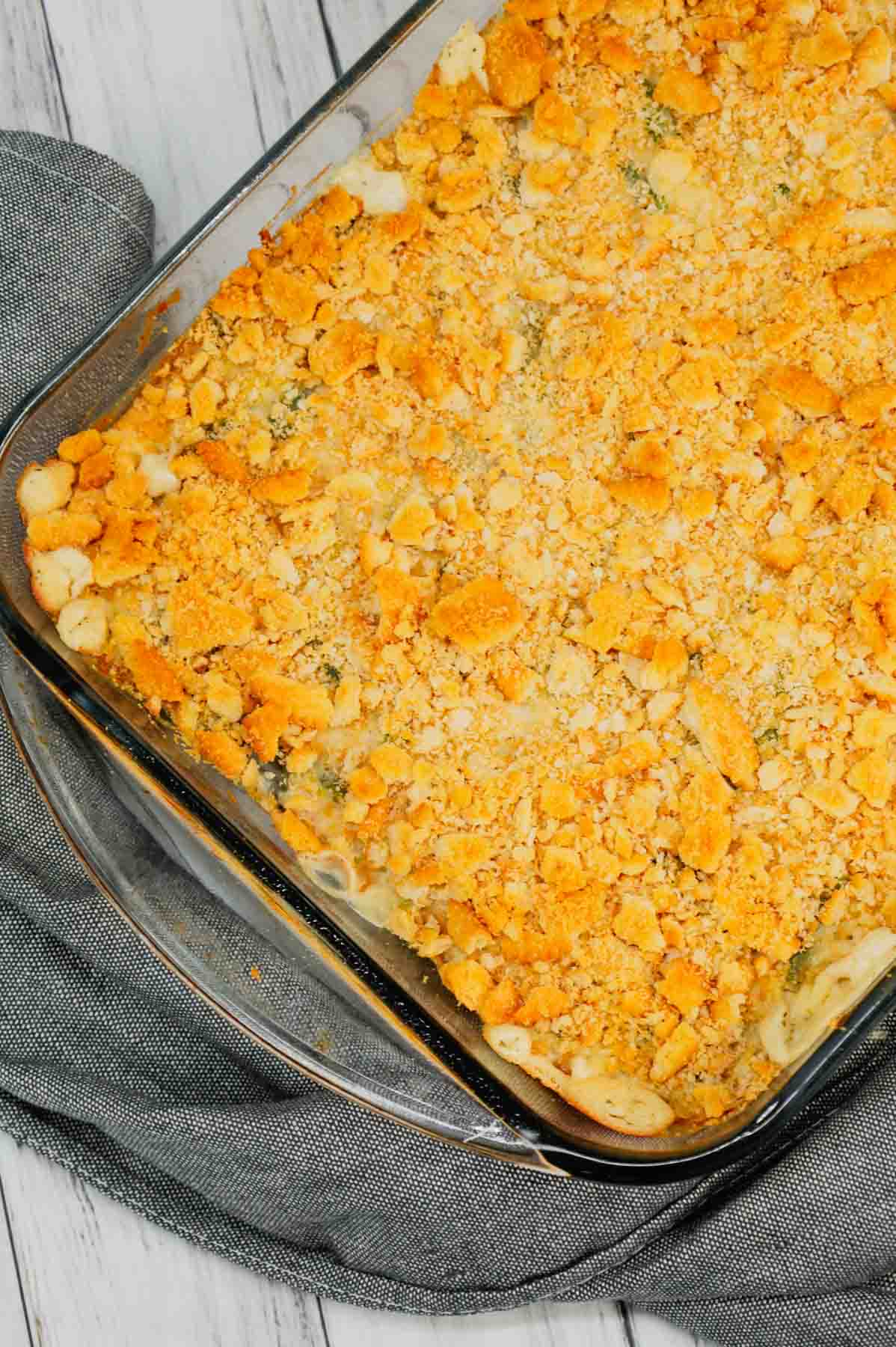 Green Bean Artichoke Casserole is a delicious holiday side dish recipe loaded with cut green beans, artichoke hears, cream cheese, sour cream, mozzarella cheese and parmesan cheese with a crushed Ritz cracker topping.