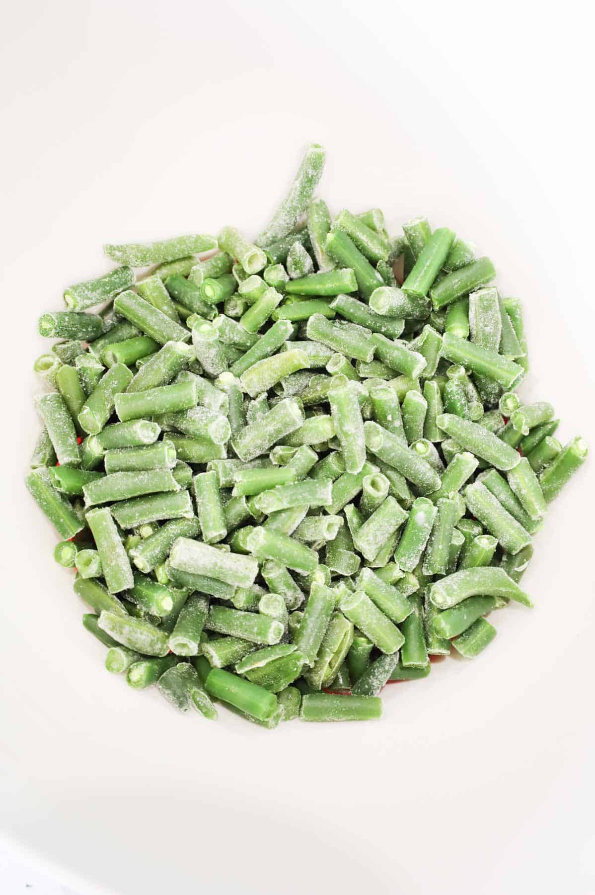 cut green beans in a mixing bowl