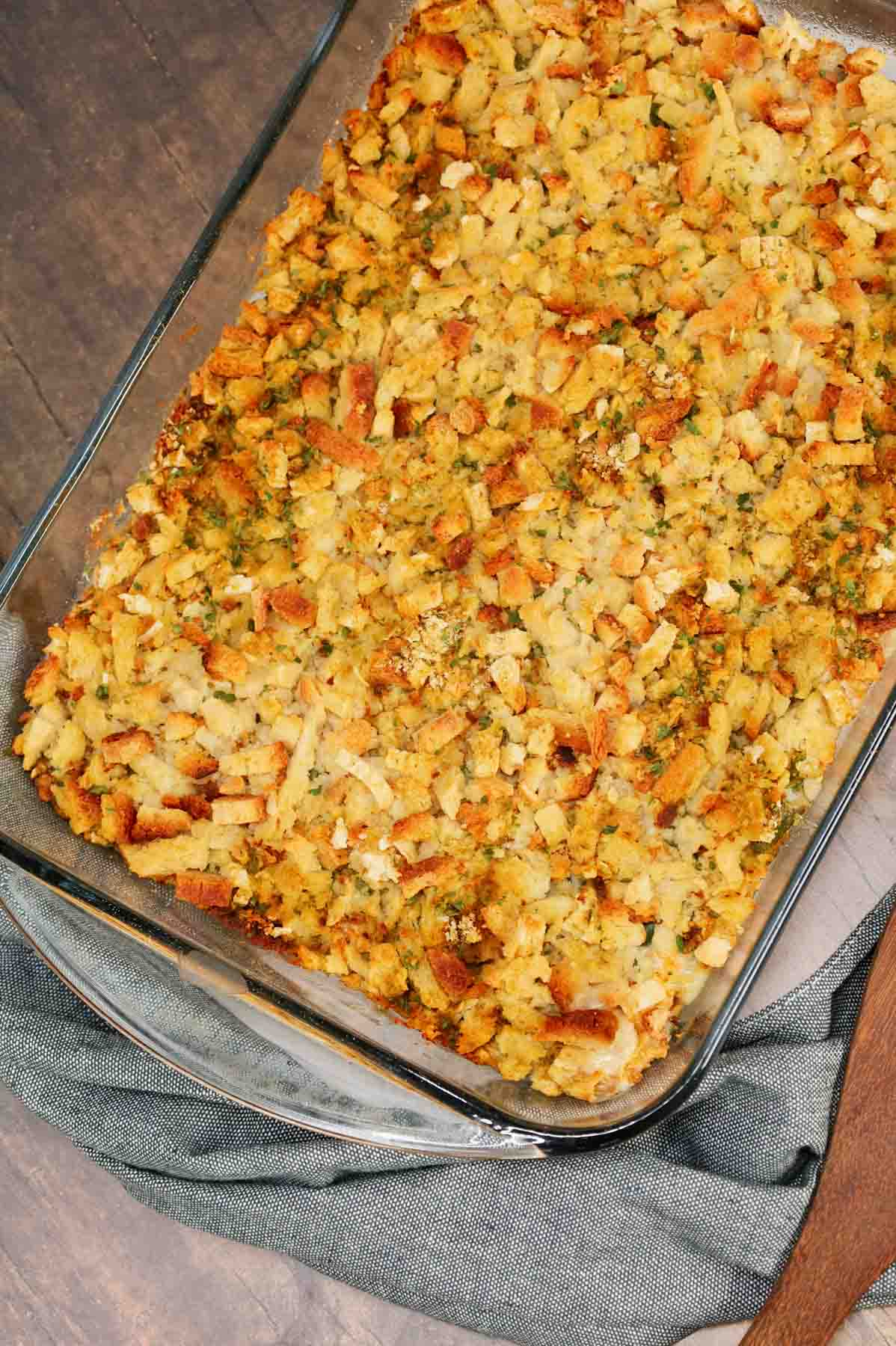 Green Bean Stuffing Casserole is a tasty side dish recipe made with frozen cut green beans, cream of mushroom soup, sour cream, French's crispy fried onions, shredded cheddar cheese, chicken broth and topped with stove top stuffing mix.