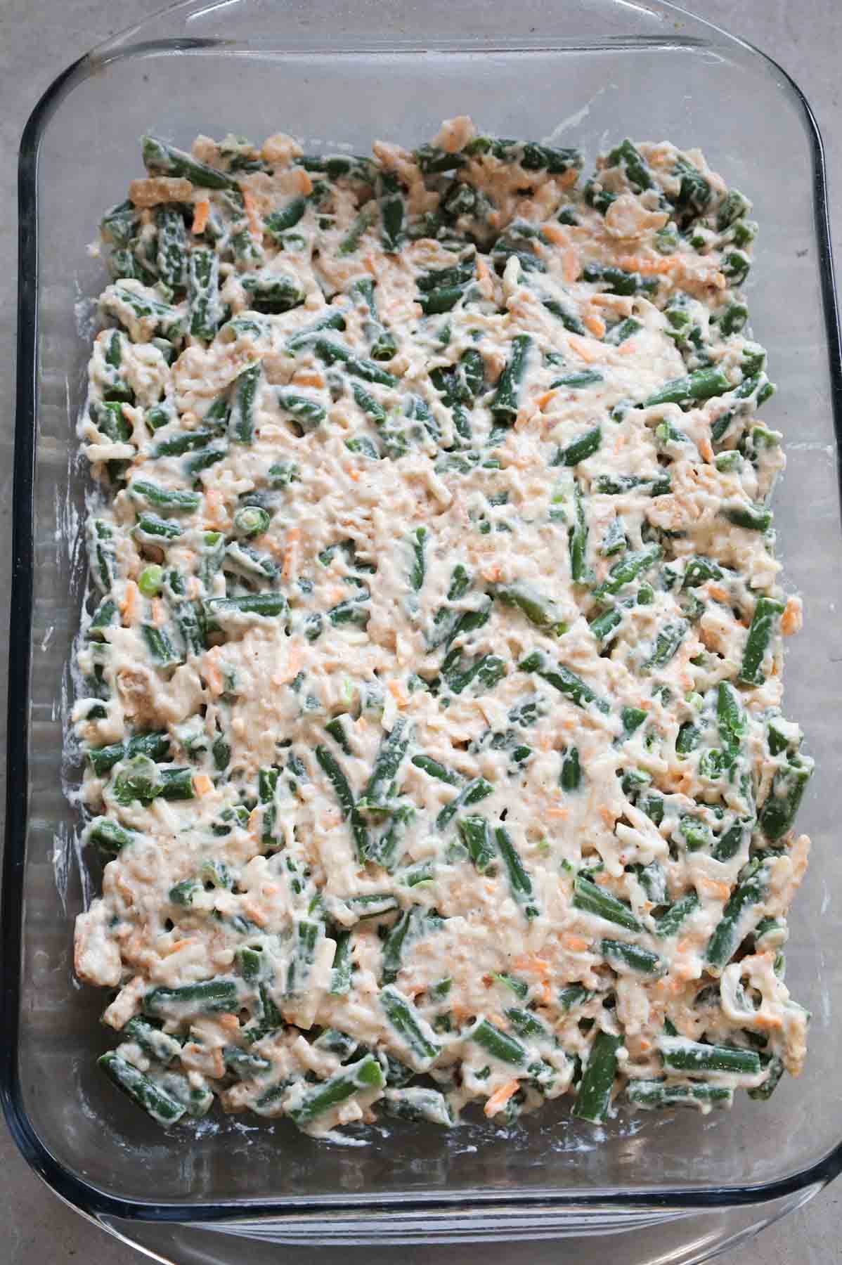 creamy green bean mixture spread in a casserole dish